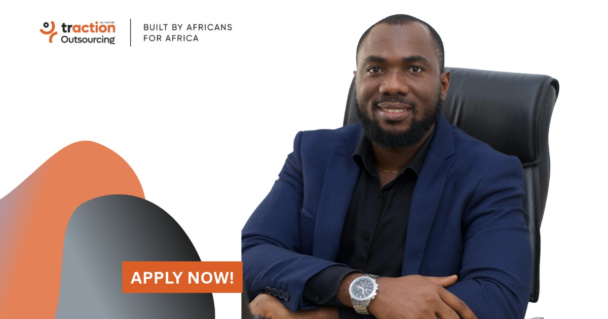 Smiling bearded man in a navy blazer and black shirt seated in an office chair beside the Traction Outsourcing logo and an Apply Now button, for the Operations Manager job