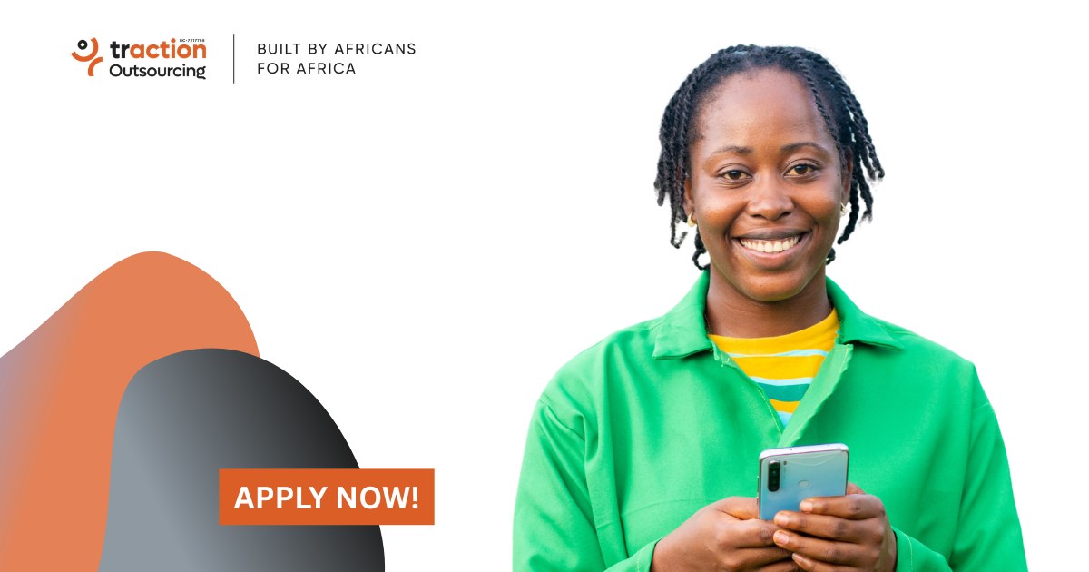 Smiling woman in a green jacket holding a phone beside the Traction Outsourcing logo and an Apply Now button, for the Storekeeping Assistant job